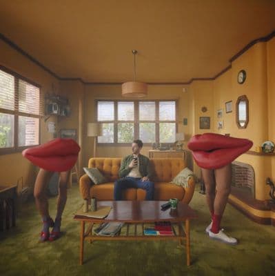 a man sitting on a couch in a living room