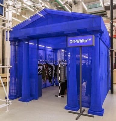 a store with a blue tent in the middle of it