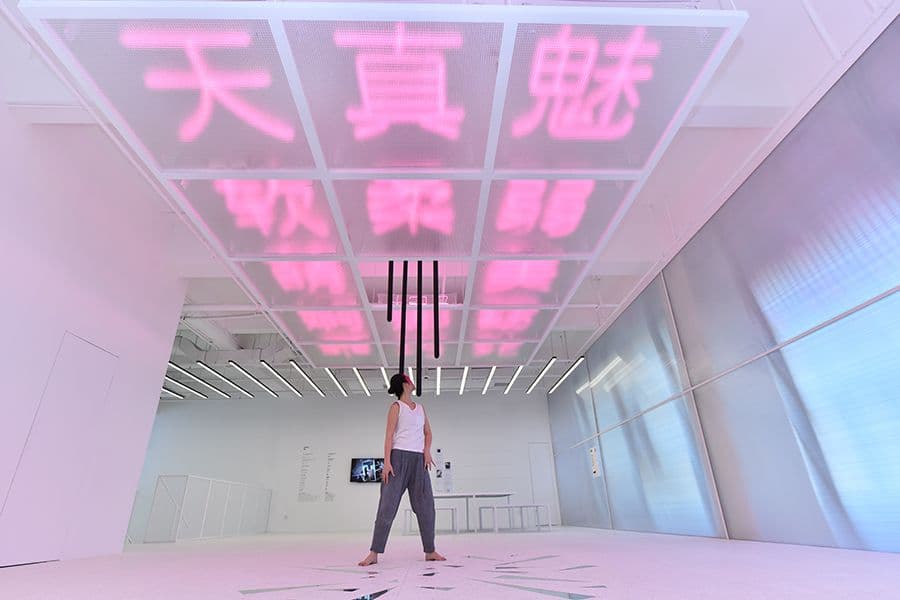 a woman is standing in a large room