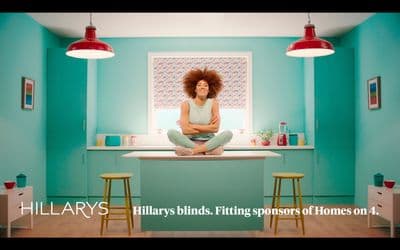 a woman sitting on top of a counter in a kitchen