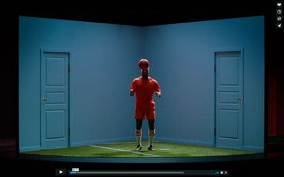 a television screen with a soccer player on it