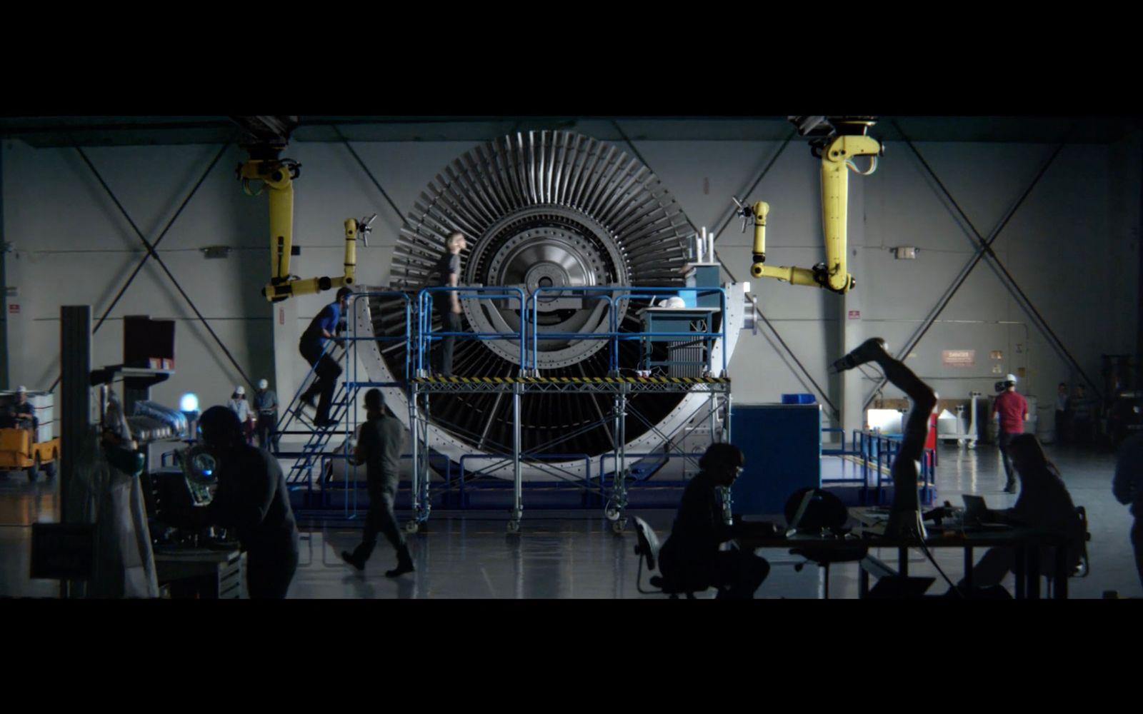 a group of people working on a large machine