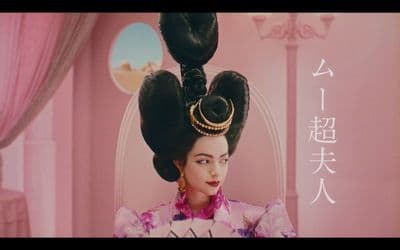 a woman with a large ponytail in a room