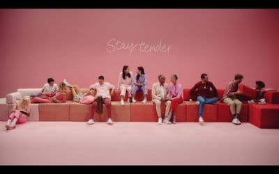 a group of people sitting on top of a couch