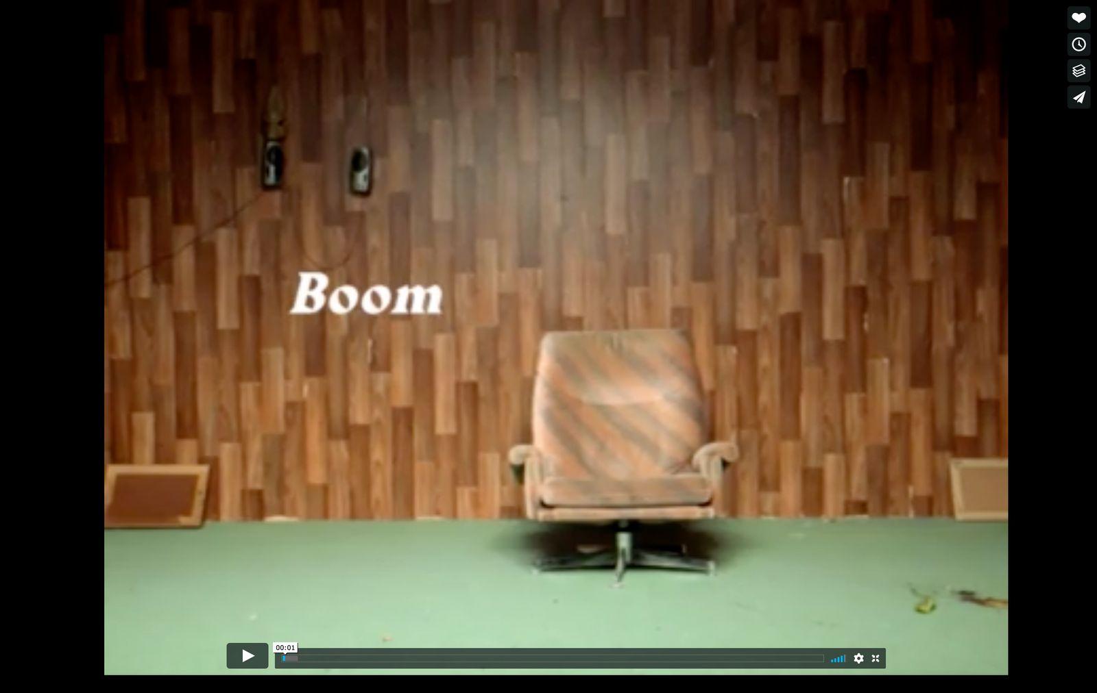 a chair sitting in front of a wooden wall