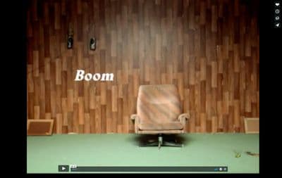 a chair sitting in front of a wooden wall
