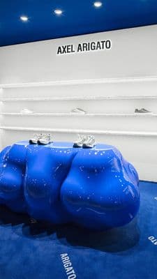a blue bench sitting on top of a blue carpet