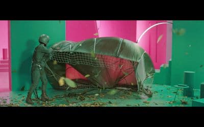 a man standing next to a green and pink room