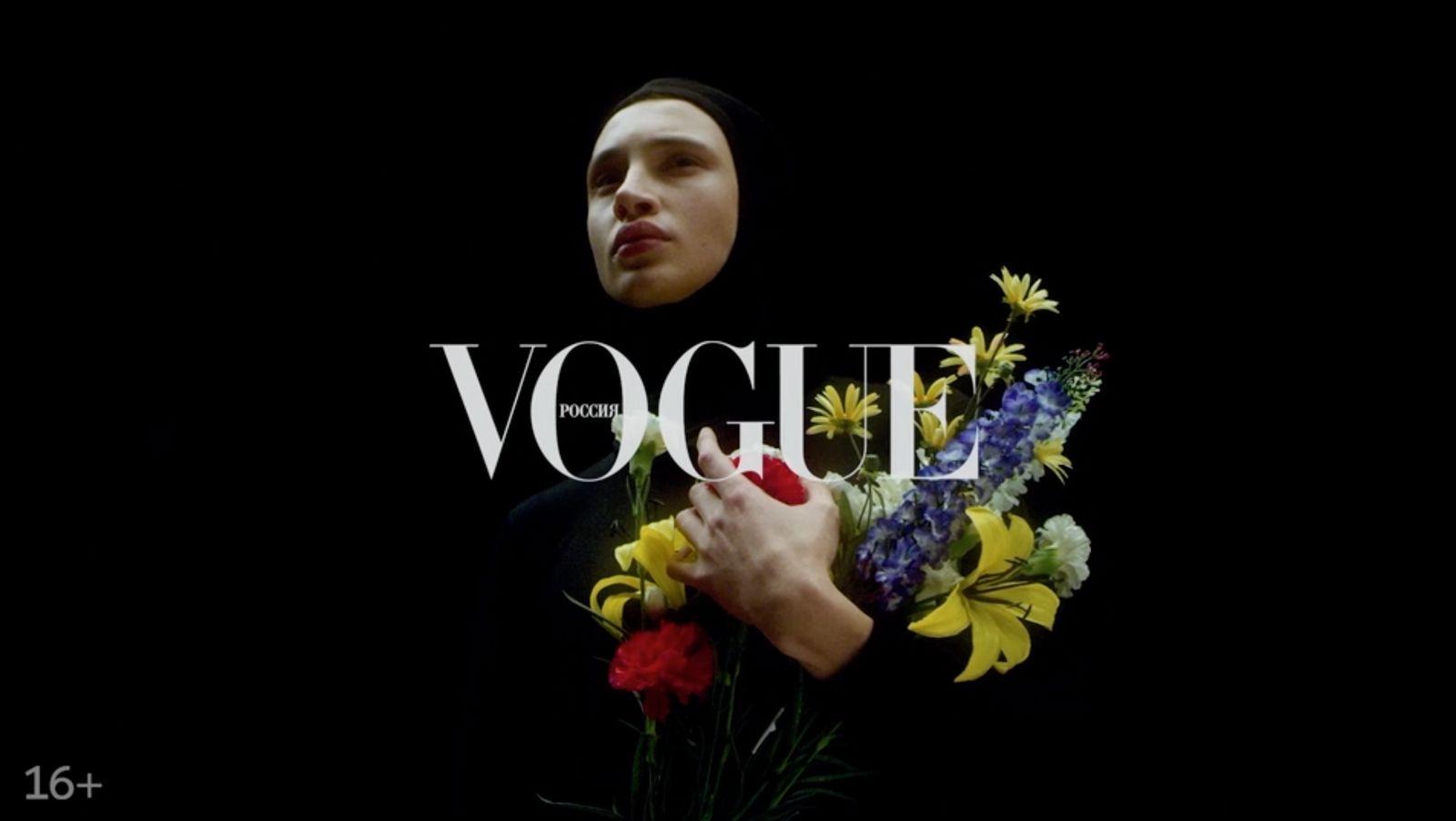 a woman holding a bouquet of flowers in front of a black background
