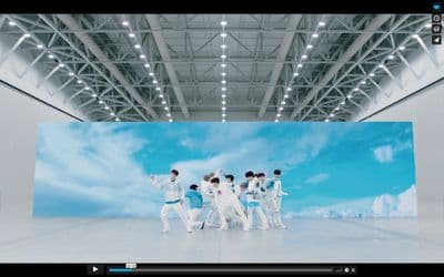 a group of men standing on top of a white floor