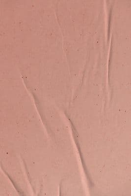 a close up of a piece of pink paper