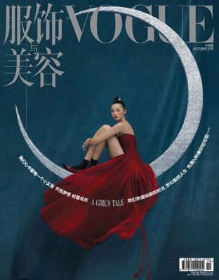 a woman in a red dress sitting on the moon