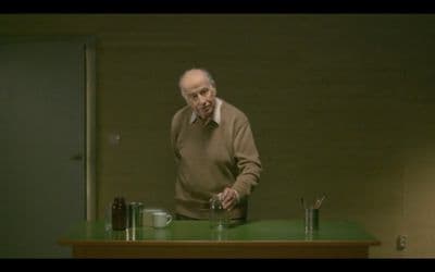 a man standing in front of a green counter