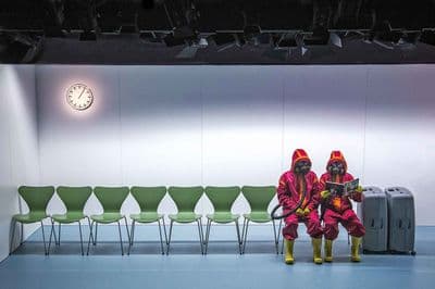 a couple of people sitting next to each other
