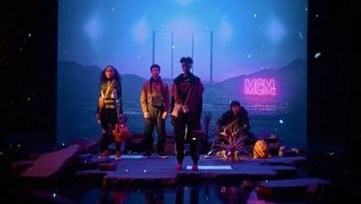 a group of people standing on top of a stage