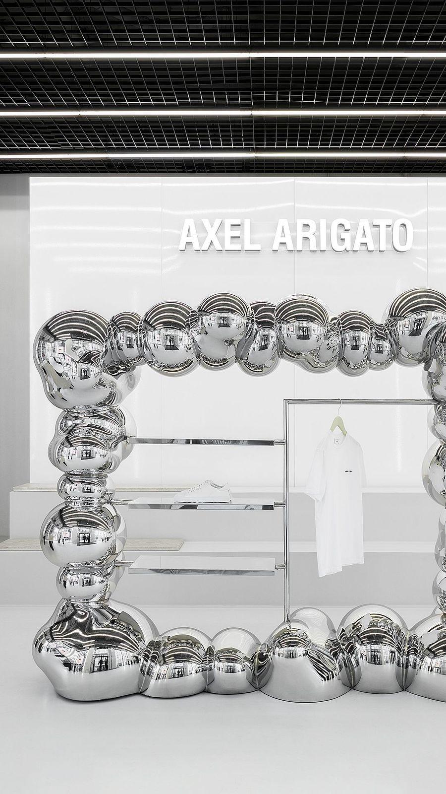 a display of chrome balls in a store window