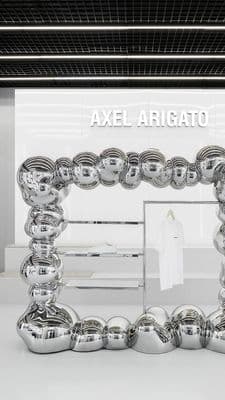 a display of chrome balls in a store window