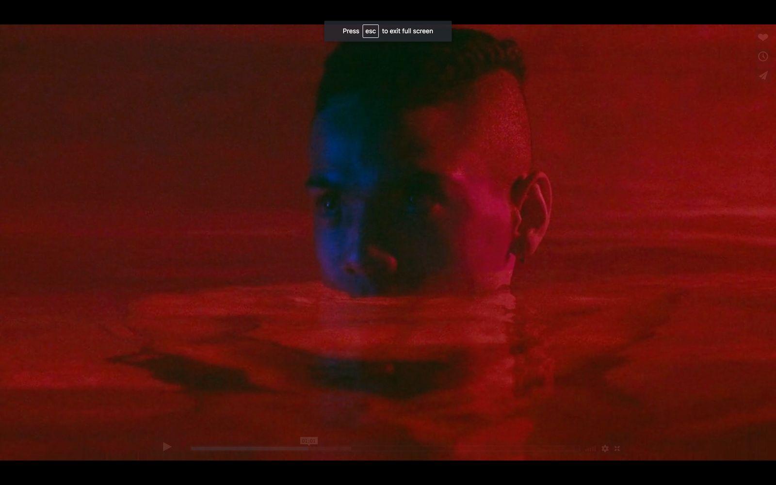 a man swimming in a pool of water