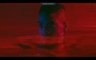a man swimming in a pool of water