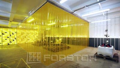 a room that has a yellow curtain in it