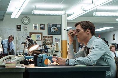 a man sitting at a desk in an office