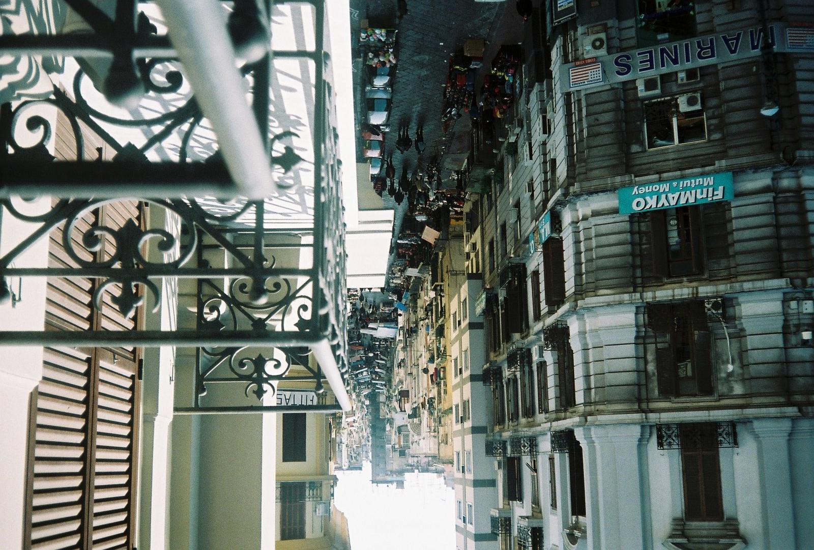a view of a city street from a balcony