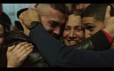 a group of people hugging each other in a group