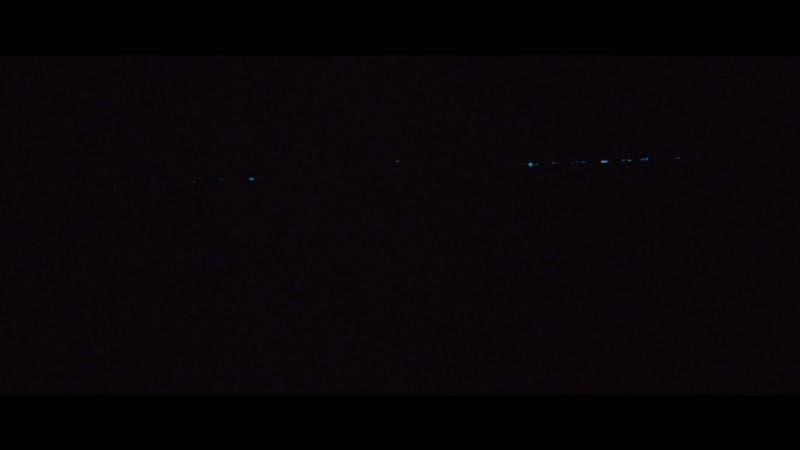 a plane flying in the sky at night
