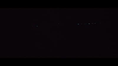 a plane flying in the sky at night