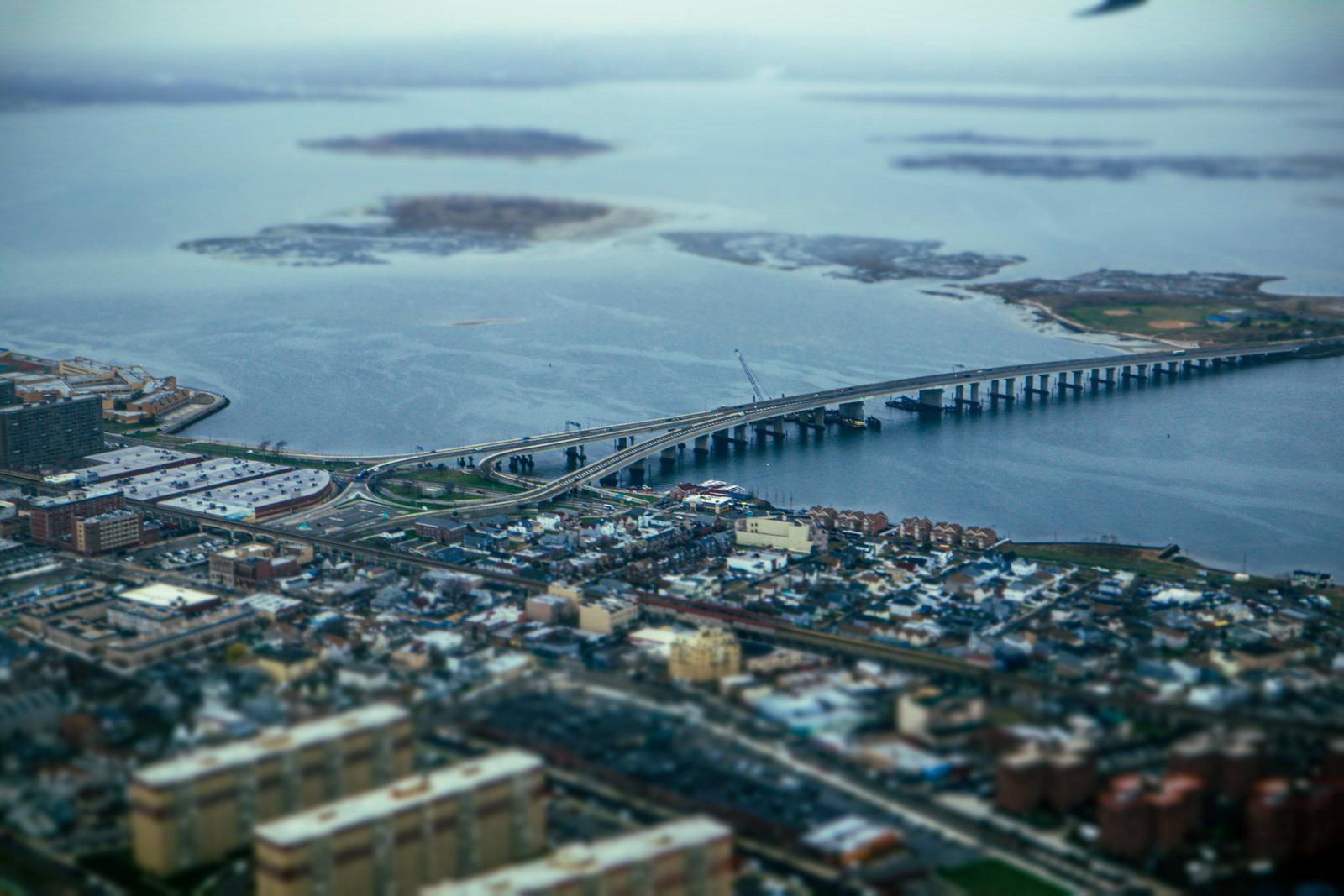 an aerial view of a bridge over a large body of water