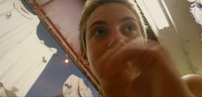 a woman taking a selfie in front of a mirror