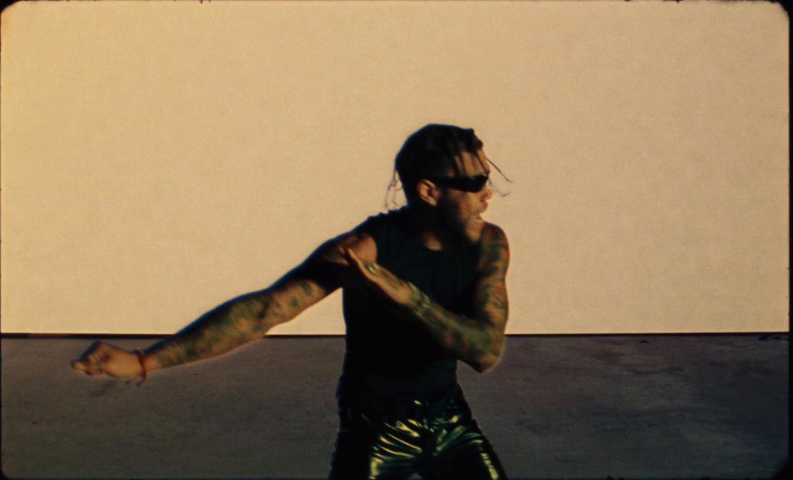 a man with tattoos on his arms and arms