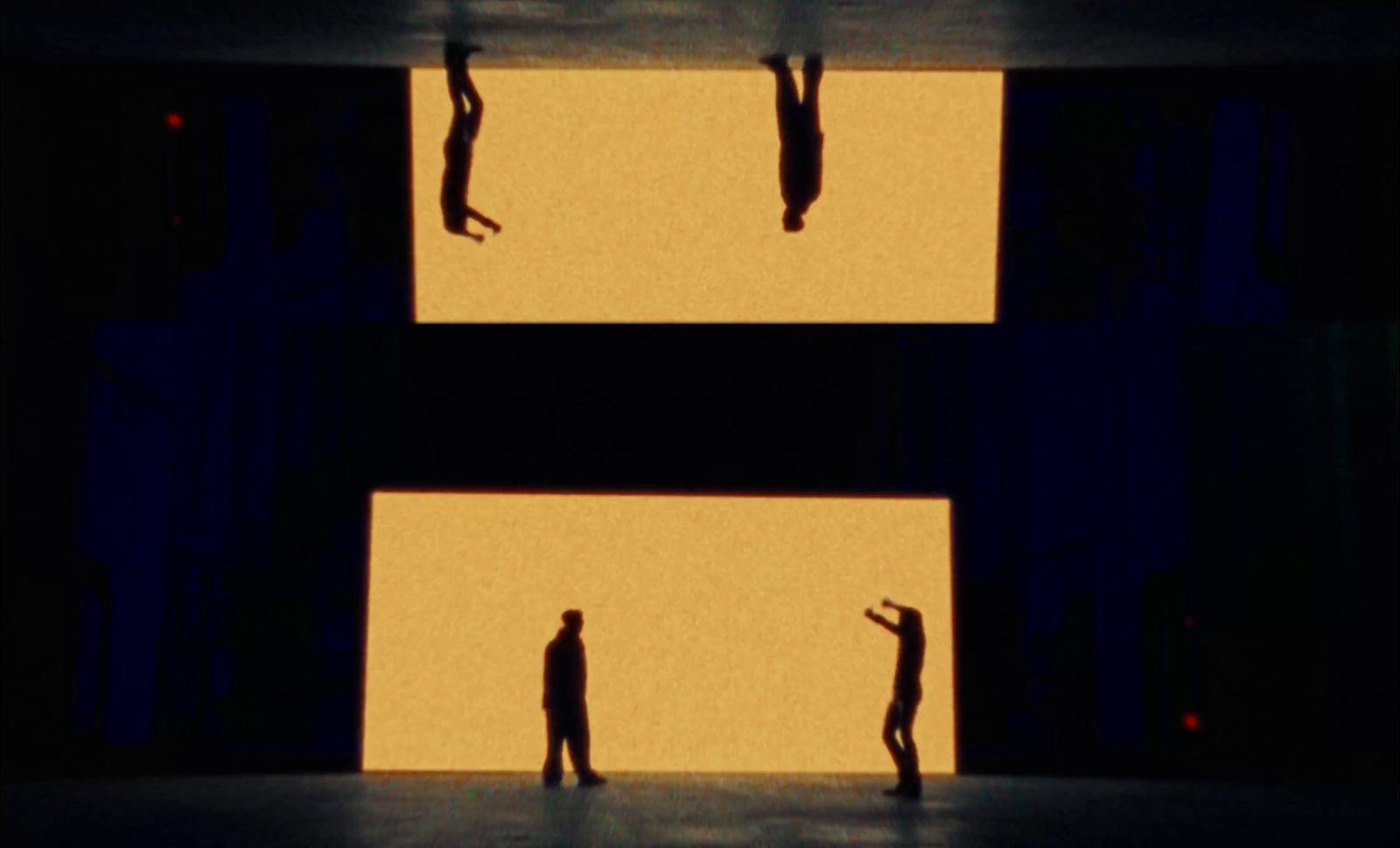 a couple of people standing on top of a stage