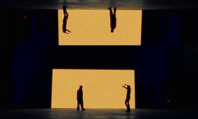 a couple of people standing on top of a stage