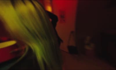 a blurry photo of a woman with long hair