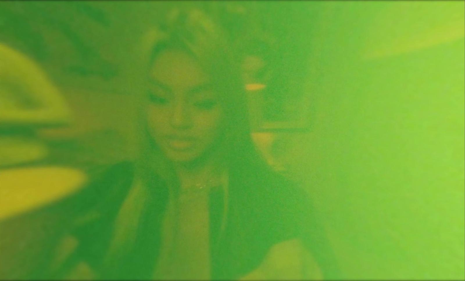 a blurry photo of a woman sitting at a table