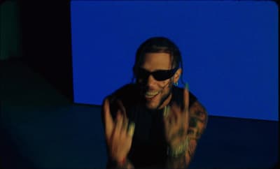 a man wearing sunglasses and a black shirt
