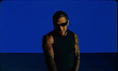 a man with a tattoo on his arm