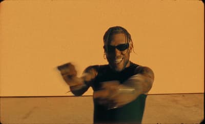 a man wearing sunglasses and a black shirt