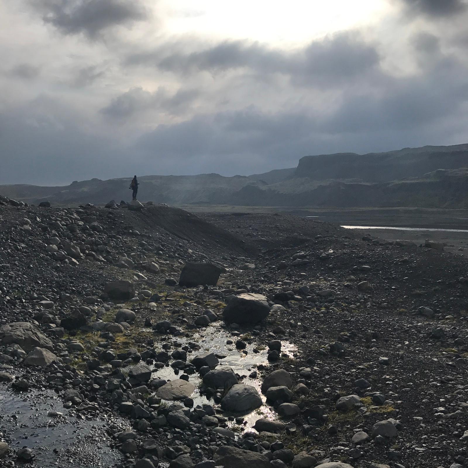 a view of the ocean from a rocky beach