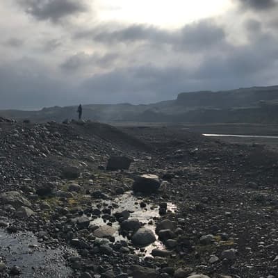 a view of the ocean from a rocky beach
