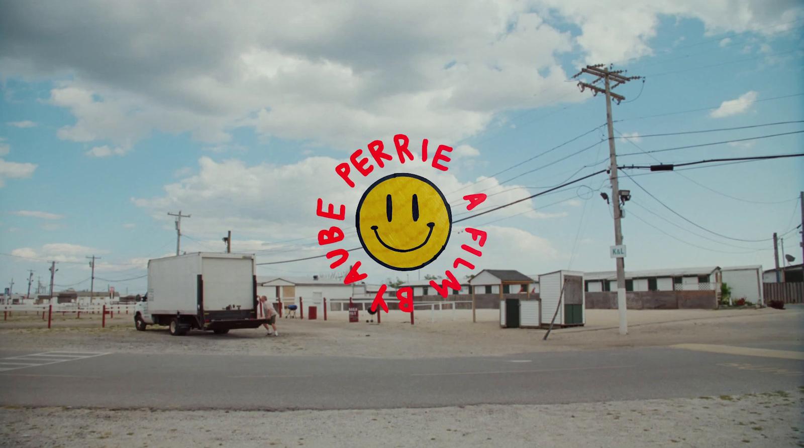 a yellow smiley face sign on the side of a road