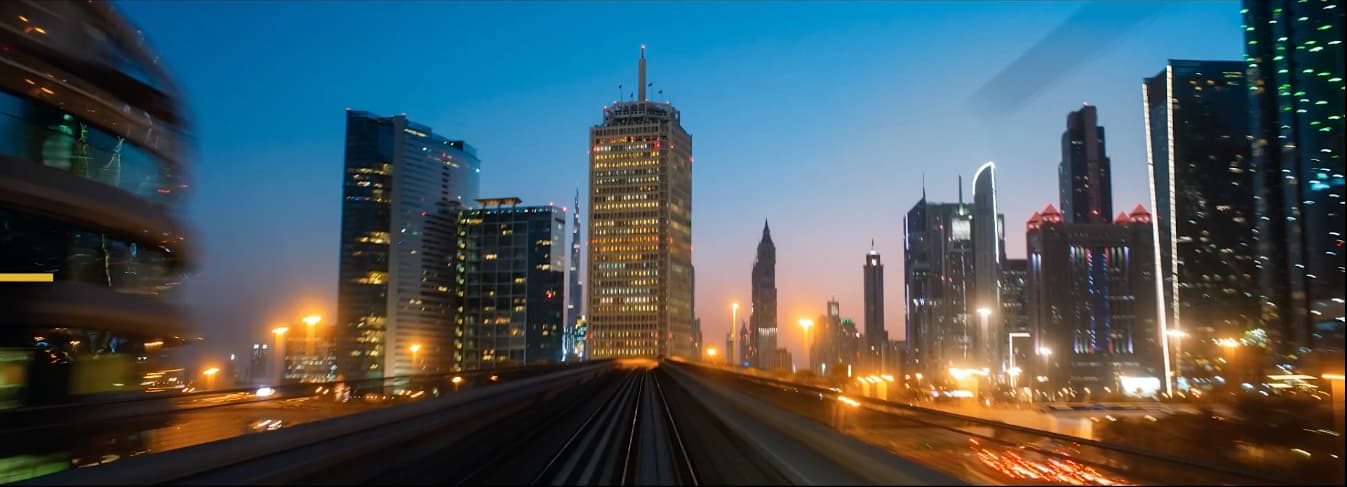 a train traveling through a city at night