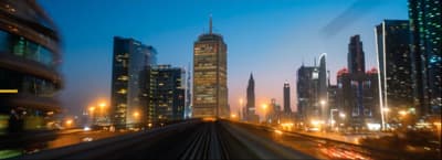 a train traveling through a city at night