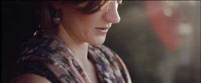 a woman with a scarf around her neck