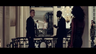 a group of people standing around a room