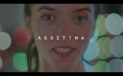 a woman smiling with the words agostina in front of her