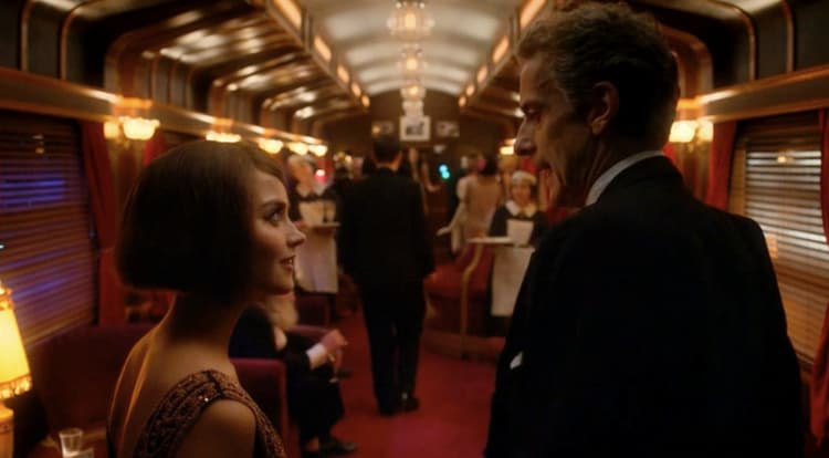 a man and a woman standing on a train