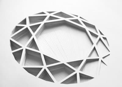 a circular object made out of white paper