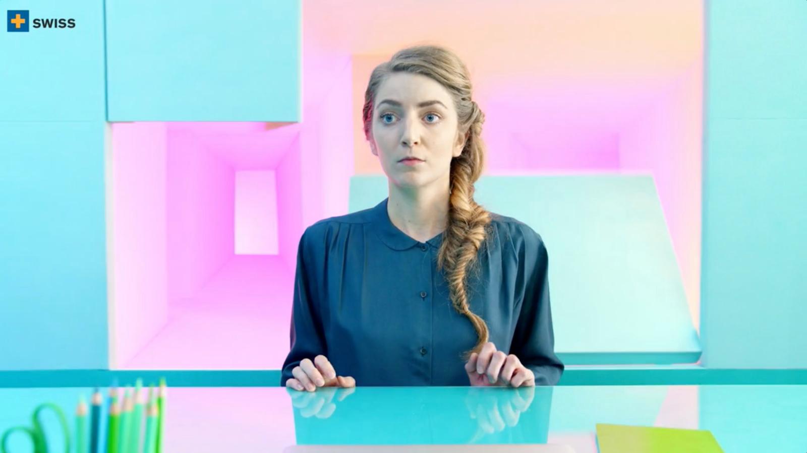 a woman sitting at a table with scissors in front of her